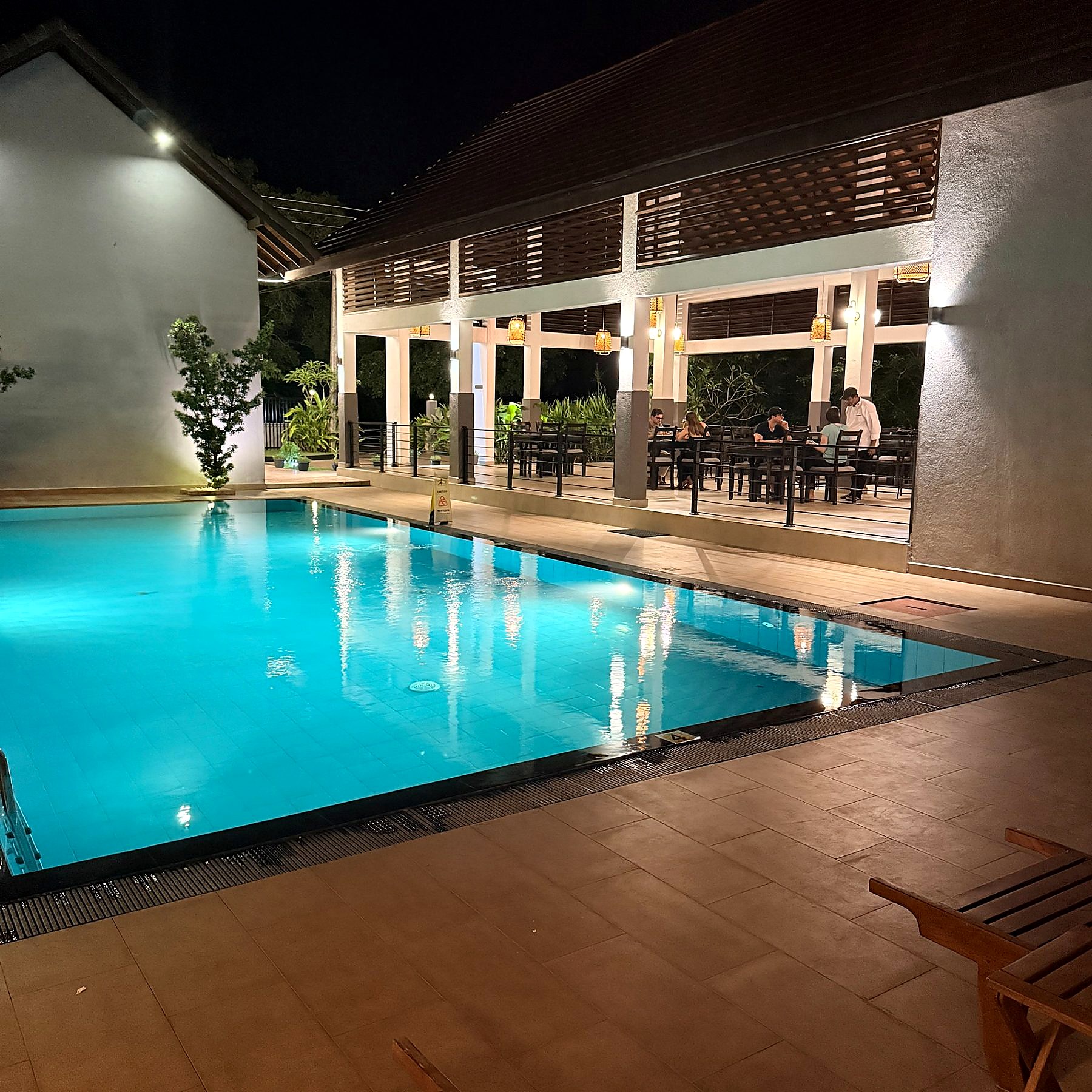 Pool and restaurant at night